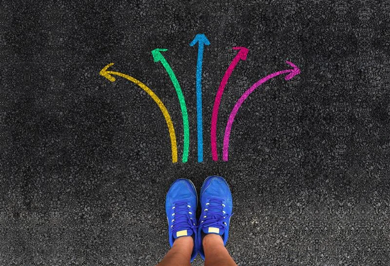 Image of a pair of shoes with colourful arrows around it