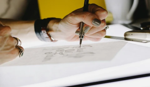 A person drawing.