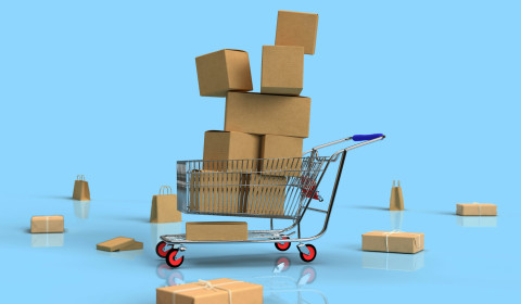 A trolley filled with cardboard boxes.