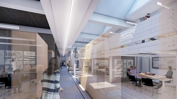 Image of an office space with desks and monitors