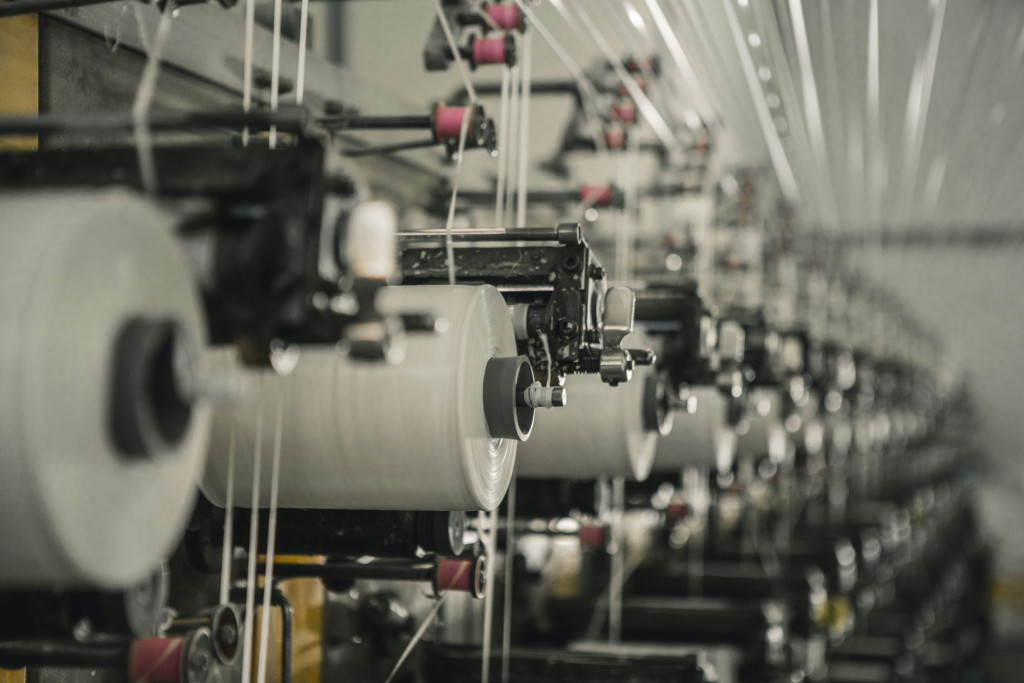 Factory machines spinning garment fabrics