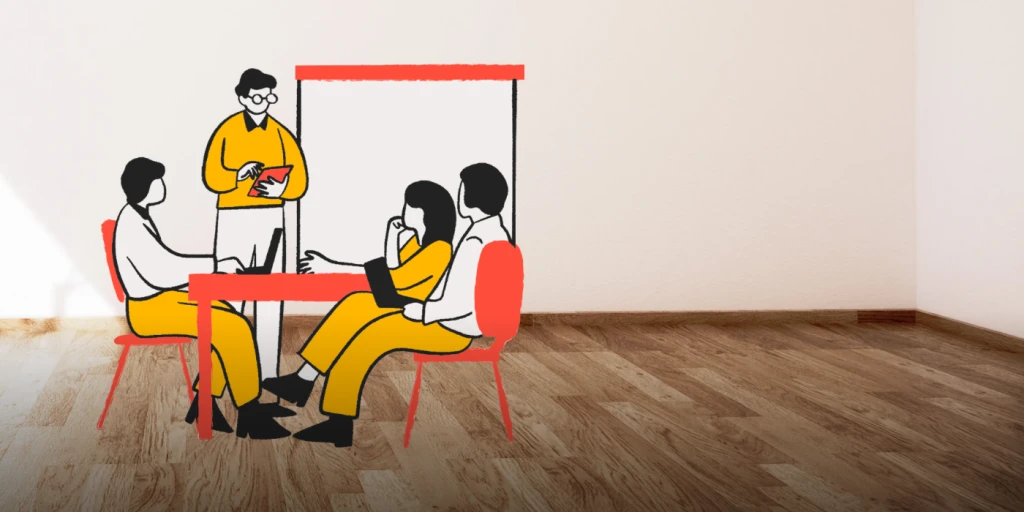 Animated image with 3 people sitting at a table and one person standing at the right hand side. On the left hand side is wiring in red in Irish 'An Ghaeilge agus na hEolaiochtai Soisialta' which means 'The Irish Language and Social Sciences'
