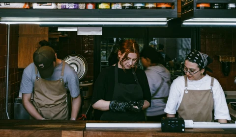 Photograph of young people working in a restaurant kitchen